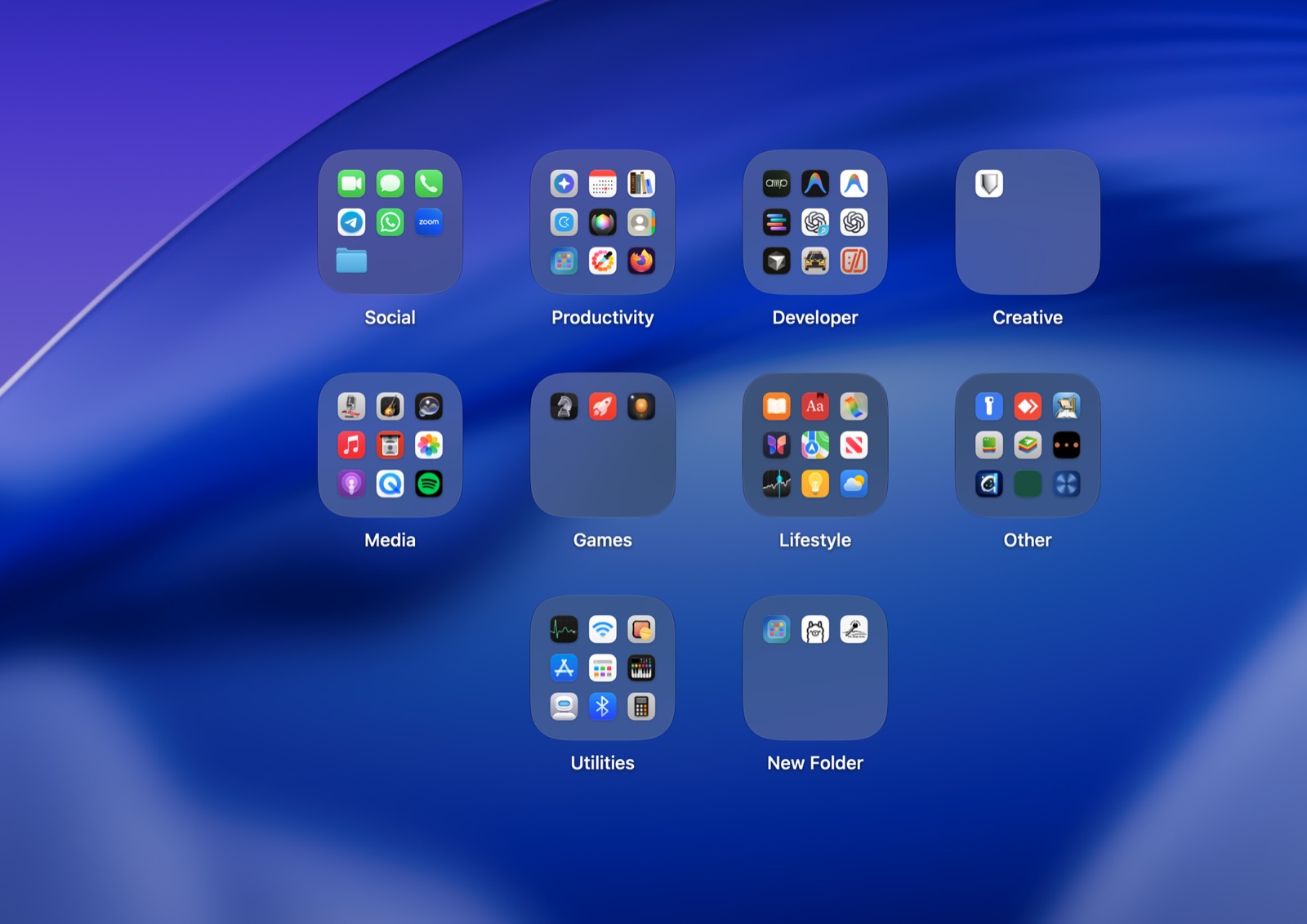 Ten Deskfold folders on a Mac desktop: Social, Productivity, Developer, Creative, Media, Games, Lifestyle, Other, Utilities and a new folder